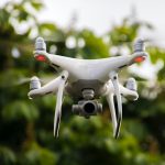 white and gray quadcopter drone